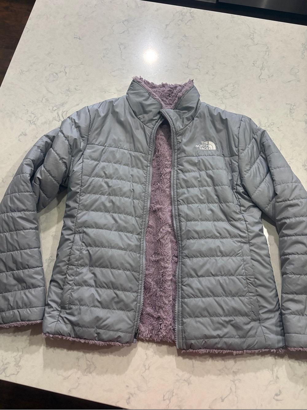 The North Face Girl’s Light Gray Puffer with Lavender Fleece Reversible Lining